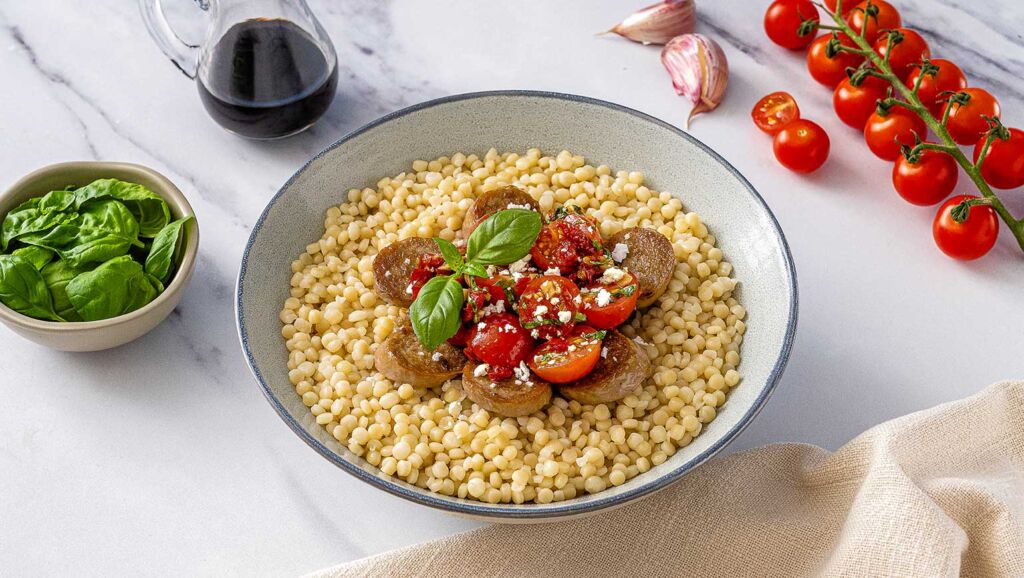Sun-Dried Tomato Bruschetta Pearl Couscous Bowl with Chicken Sausage