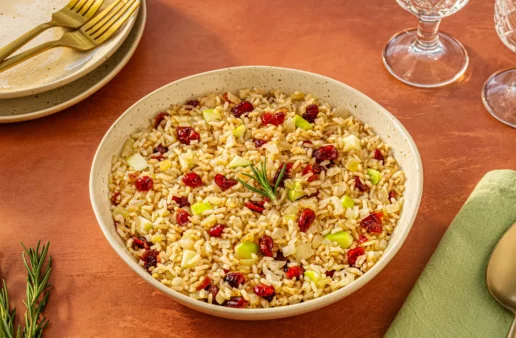 cranberry apple rice pilaf served in a white plate
